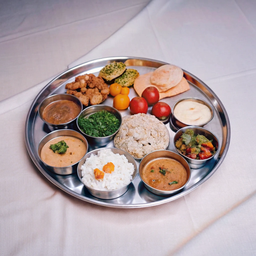 Plate of Food on a White Table Cloth