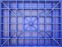 A Blue Box with Metal Bars in It