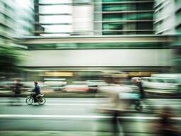 Blurry Image of People Crossing the Street