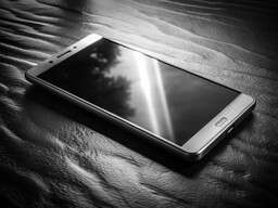 Black and White Photo of a Phone on a Table