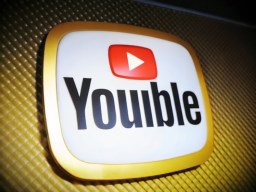 television screen 위의 youtube logo is seen