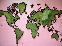 Pink Wall with a World Map on It