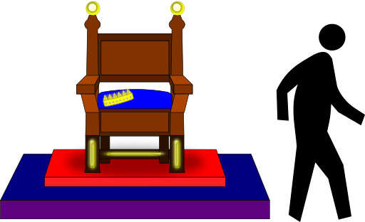 A Man Standing Next To A Chair