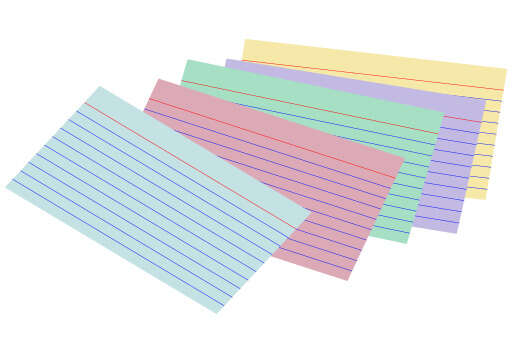 A Close Up of a Pile of Colored Paper on a White Background