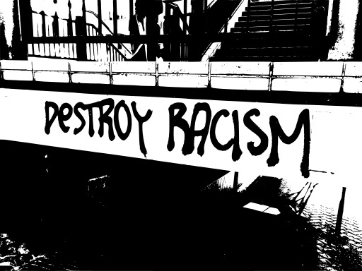 블랙 And White Image Of A Bridge With Graffiti Written On It