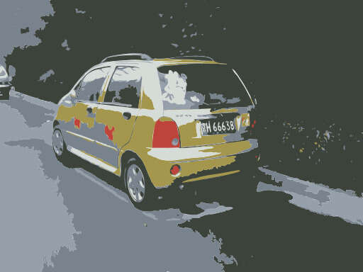 Yellow Taxi Car Driving Down A Street