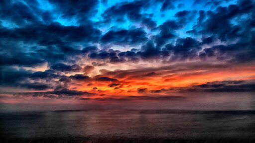 A Sunset Over The Ocean 와 구름 에 The Sky