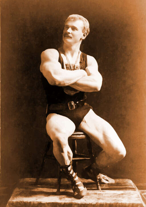 An Old Photo Of A Man Sitting On A Chair
