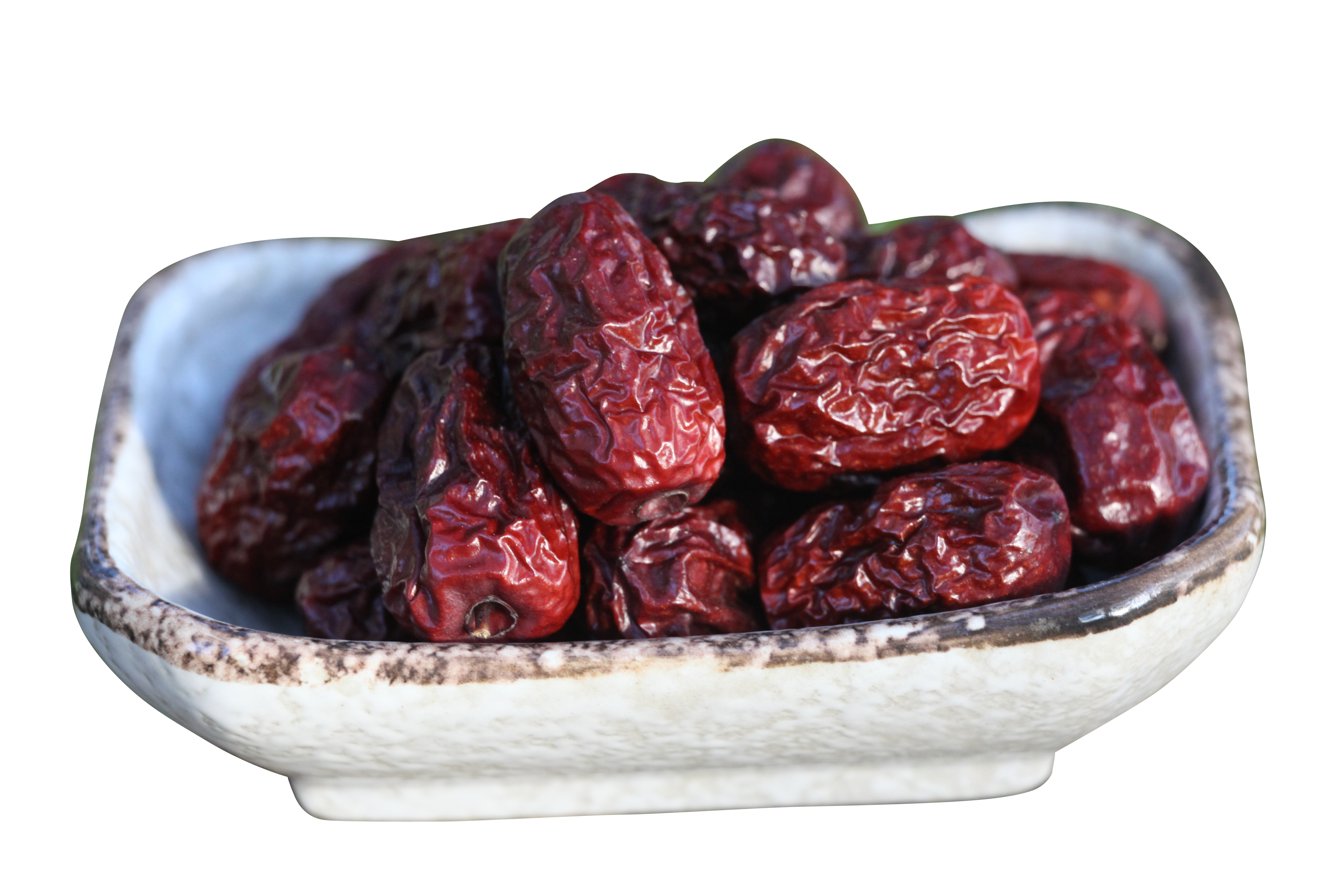 흰색 배경 위의 그릇 dried dates