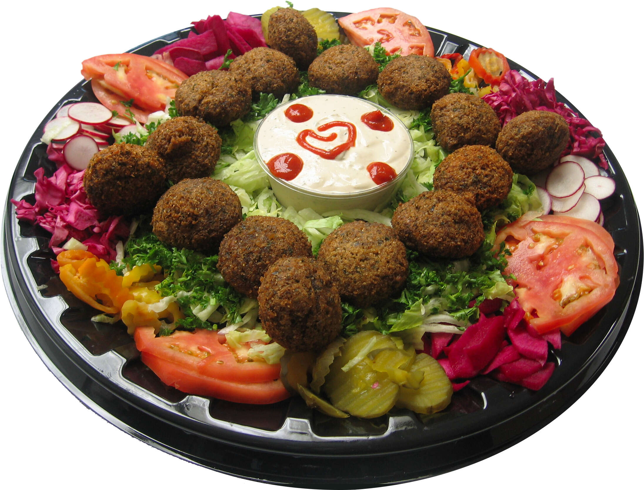 Tomatoes, lettuce, cucumber, and other vegetables are arranged in a circle on a platter