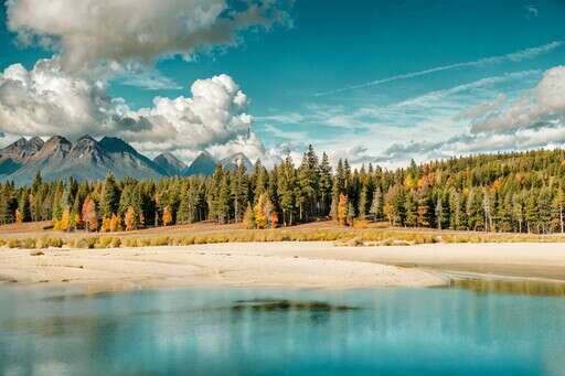 A Lake With A Mountain In The Background