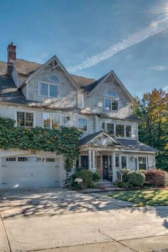 A Large House With A Driveway In Front Of It