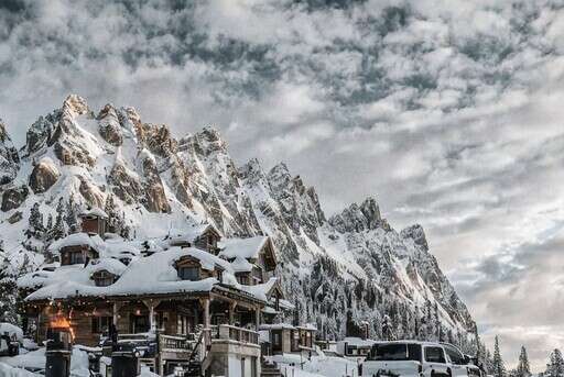 A House In The Mountains Covered In Snow