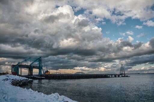 a Large Body of Water with a Bridge in the 3