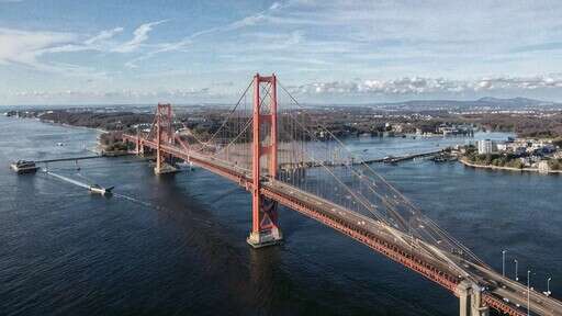 Aerial View of a Bridge Spanning the Width of a Body of Water