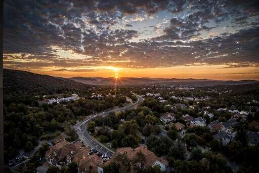 an Aerial View of a Sunset Over a Residential Area