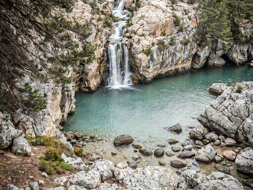 a Small Waterfall in the Middle of a Rocky Gorge