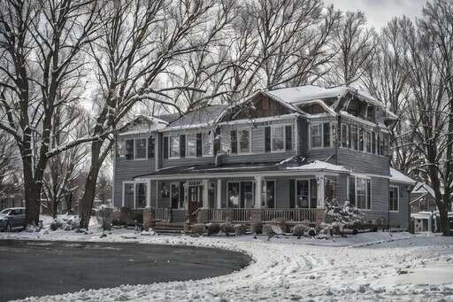 an Image of a House in the Winter with a Lot of Snow on the Ground