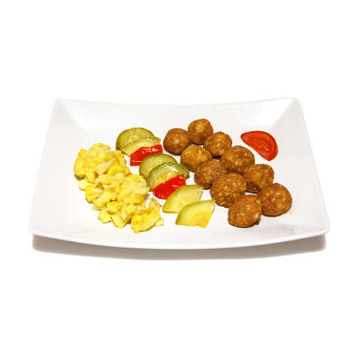 a plate of food that includes meatballs pineapples tomatoes and broccoli