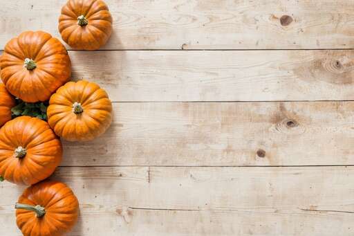 multiple pumpkins on wood