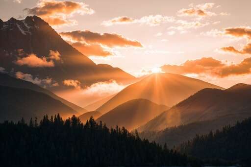 sunset over the mountains in orange light