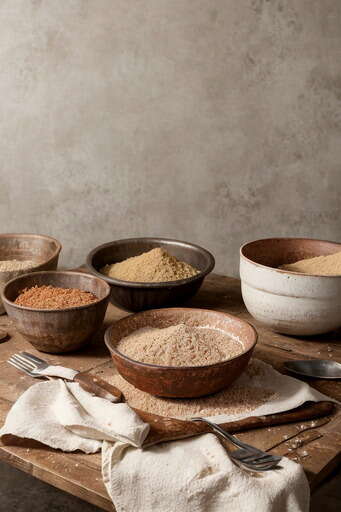 A Wooden Table Topped With Bowls Of Food And Utensils 01